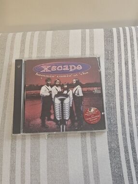 Xscape CD with Red and Purple Album Artwork